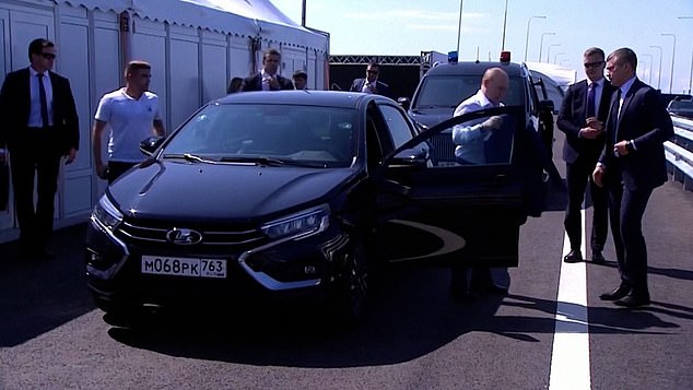 When he got out of the vehicle after the near-miss, Putin's security team surrounded him.