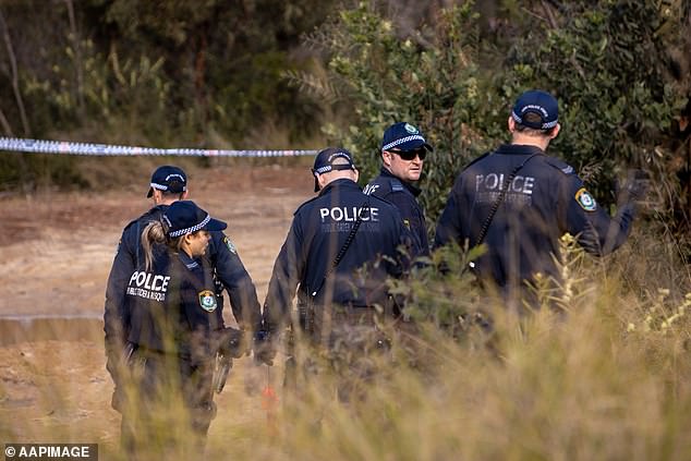 Police said Carroll lived in Sydney's inner west but was known to frequent the south-west. Pictured: NSW Police search woodland near Sandy Point Quarry in Menai in July 2020