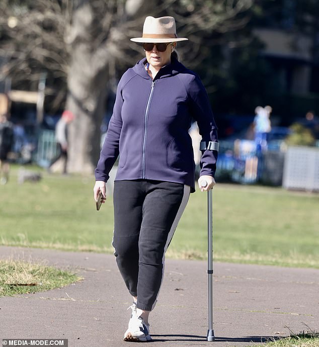 The TV presenter cut a casual figure in black track pants and a navy zip-up jacket, which she paired with a wide-brimmed brown hat and sunglasses.