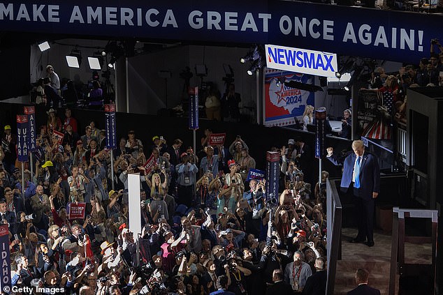 The crowd erupted into loud applause as he made his entrance.