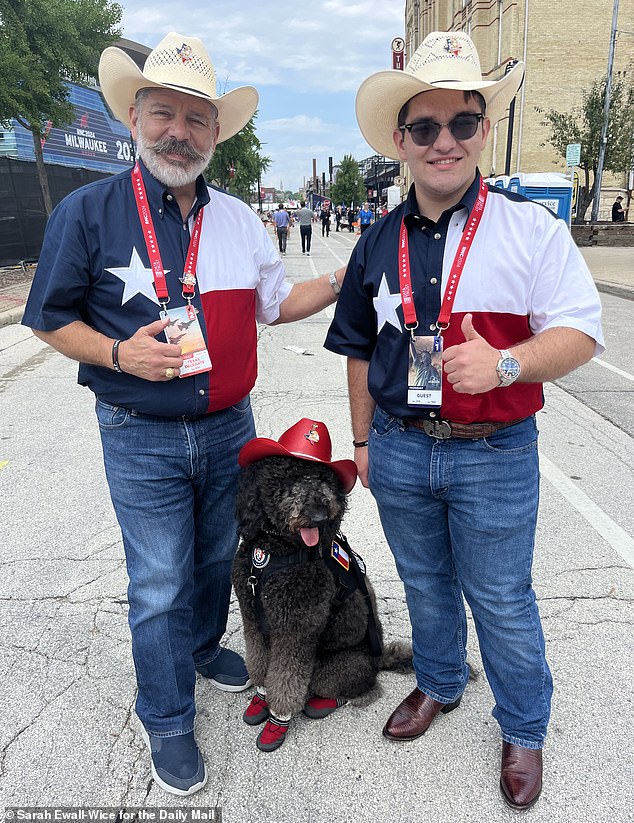 Delegate Albert Herrera and his son Yosef Herreraw with the goldendoodle Tzeitel