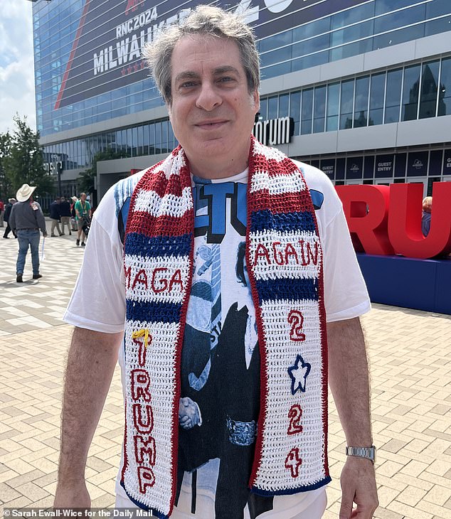 Steve Merczynski of New York with one of his hand-crocheted scarves outside the convention. His company MAGA Hammocks makes custom scarves