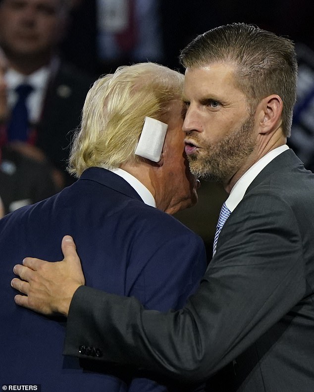 Eric Trump hugs his father in the private box at the Republican convention, three days after the failed assassination attempt