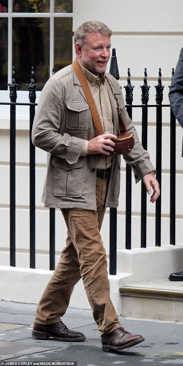 The 55-year-old director looked as dapper as ever in a tweed jacket.