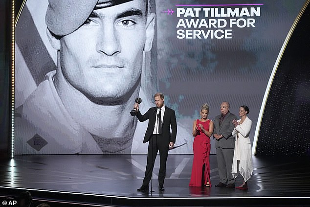 Prince Harry, who raised eyebrows last month when he was announced as the winner, was greeted on stage by three previous winners of the Pat Tillman Award.