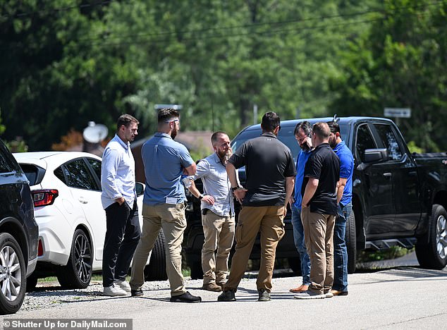 FBI agents are seen knocking on the doors of all the homes surrounding the shooters' Bethel Park home on Monday as they interview locals.