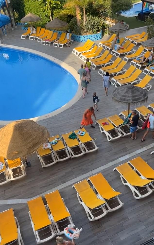 After just a few seconds, most of the prime spots by the pool at the Costa Dorada hotel were occupied.