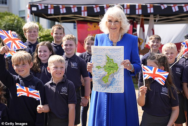 The Queen, who turns 77 tomorrow, also received a map as a gift from pupils, showing her school on the island of Guernsey.