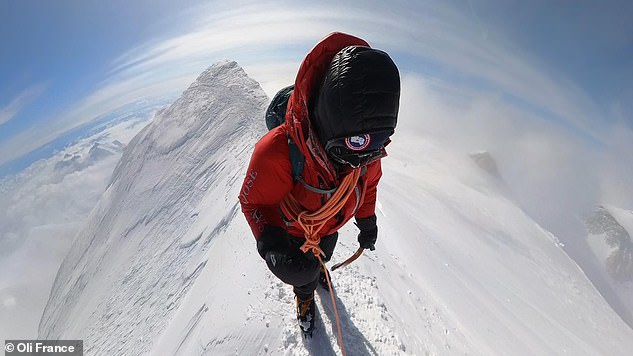 Here Oli is carefully negotiating the narrow summit ridge. The temperature? A cool -30°C.