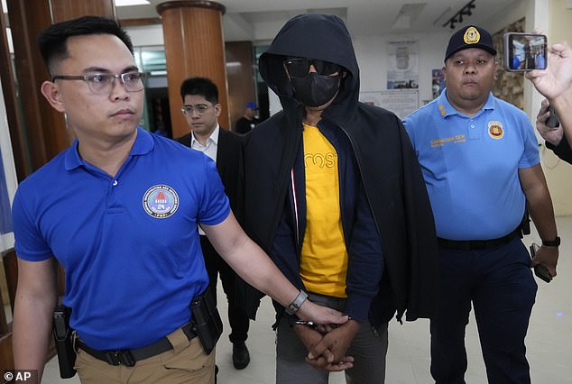 A man suspected of killing an Australian couple and their family member while they were on holiday in the Philippines has handed himself in to police (pictured)