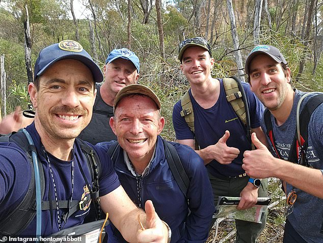 Tony Abbott is pictured, second from left at front, on an expedition with a member of the Royal Fire Brigade last year.