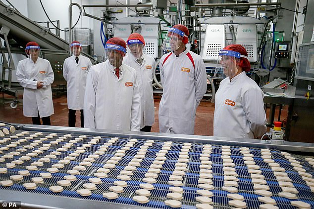 Former Prime Minister Rishi Sunak looks at the production line during a visit to Quorn headquarters