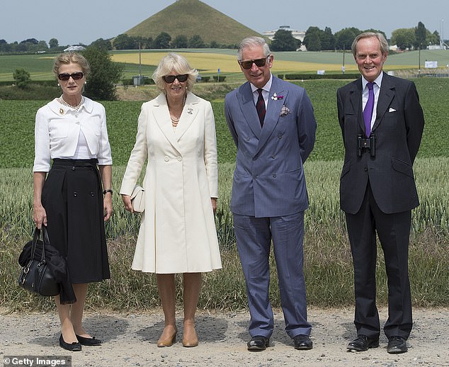 The then Prince Charles and the then Duchess Camilla are accompanied by the Duke and Duchess of Wellington during a visit to the battlefield and Lion's Mound in Belgium in 2015