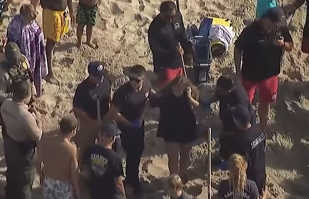 Witnesses described the harrowing scene as the teenager found herself buried 6 to 8 feet deep as the sand around her collapsed, leaving only her head and arms visible.