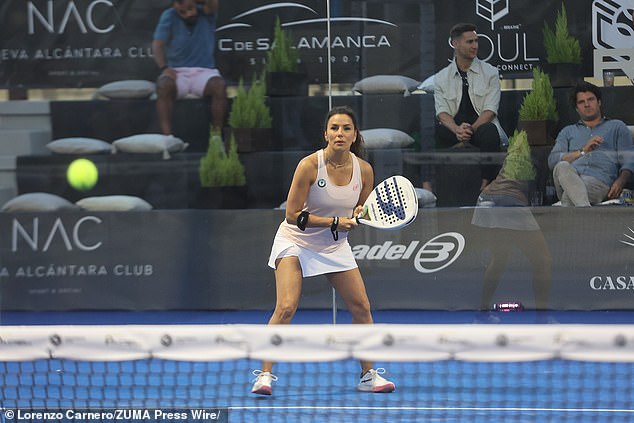 She styled her locks into a loose ponytail and appeared to be wearing no makeup as she battled it out on the court.