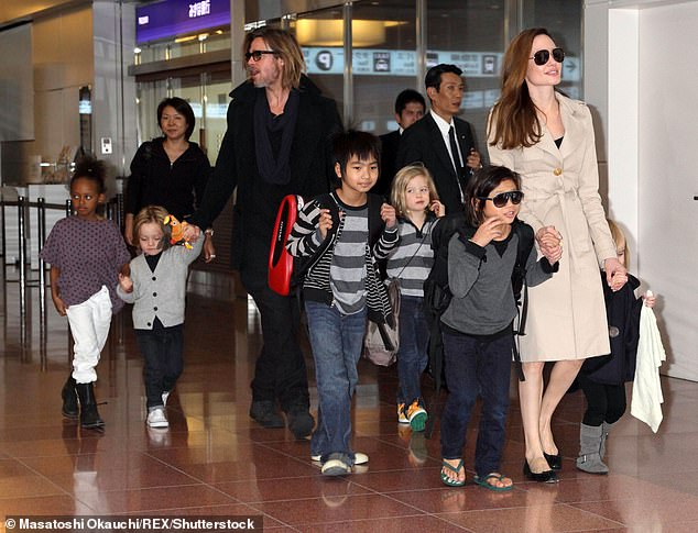 The movie stars, who met in 2004 while filming Mr. And Mrs. Smith, have six children: Maddox, 22, Pax, 20, and Knox, 15, and Zahara, 19, Shiloh, 17, and Vivienne, 15; seen on November 8, 2011 in Tokyo