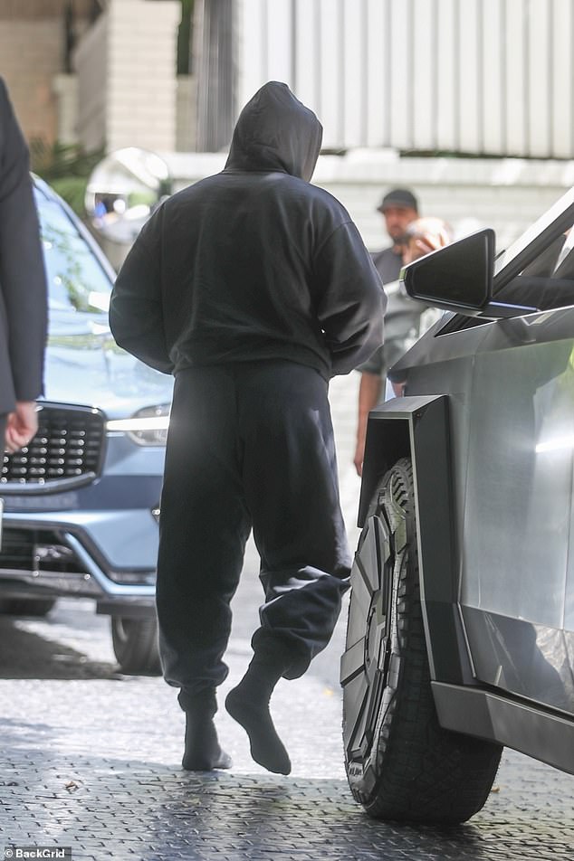 West also appeared to be wearing only socks.