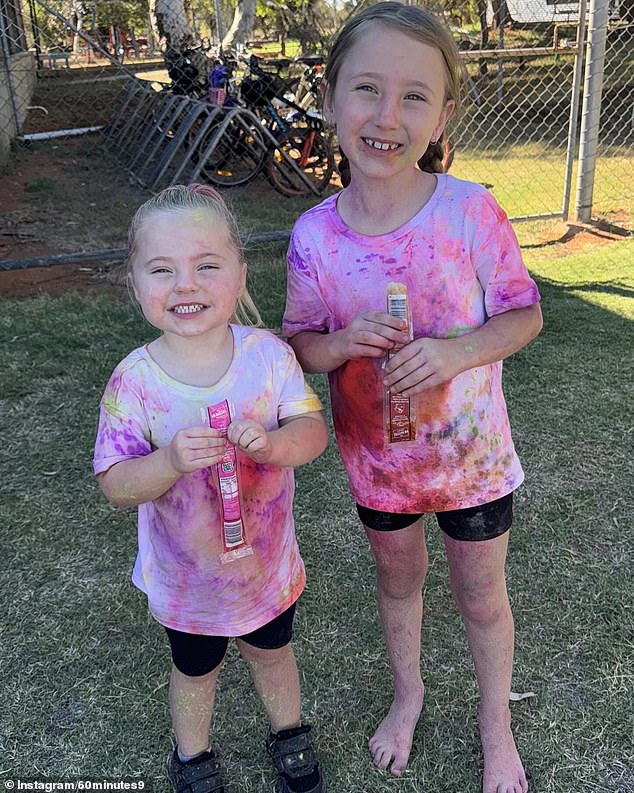 The Smith sisters enjoy a block of ice after a color run