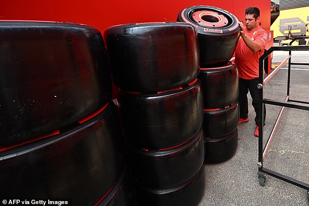 A Ferrari team member checks the team's Pirelli tyres at the Mogyorod race track in Hungary, near Budapest.