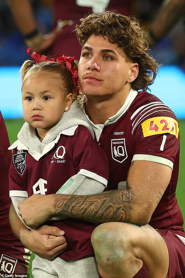 The star fullback (pictured with daughter Leila after the Game 3 loss) was also ruled out of Game 1 for a shocking illegal hit.