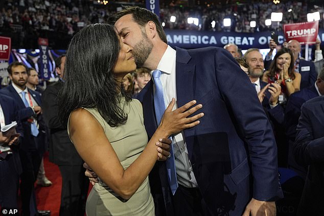 Republican vice presidential candidate JD Vance kisses his wife Usha on the convention floor in Milwaukee on Monday as he is officially nominated for the Republican nomination.