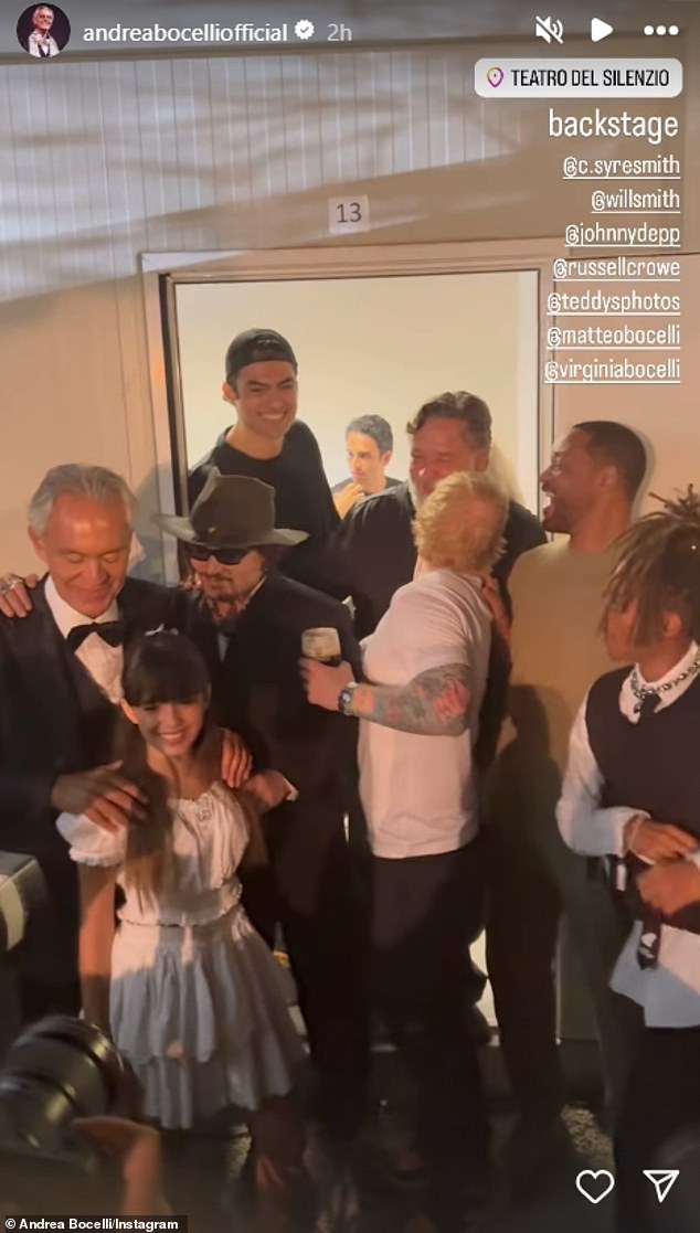 Depp joined the group backstage and was seen saying something inaudible into Andrea's ear, following his moving performance earlier in the night, which also served as a tribute to the actor's late friend and collaborator Jeff Beck.