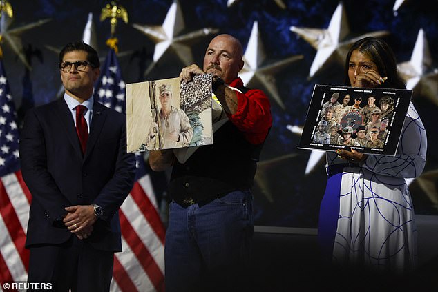 Trump remained standing as family members took the stage to speak.