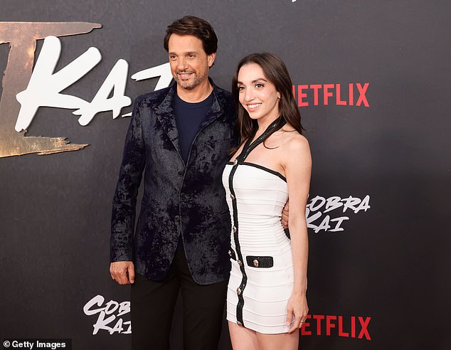 For the event, the Karate Kid star wore a navy shirt with a black blazer and matching pants, while the 32-year-old sported a black and white halter dress with gold detailing.