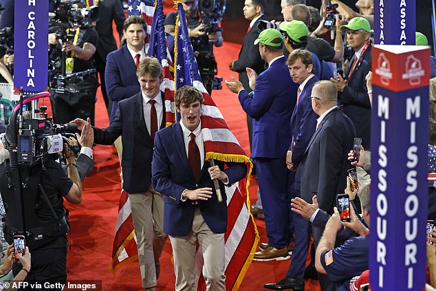 The brothers all dressed in blue suits, white shirts, red ties and khaki pants.