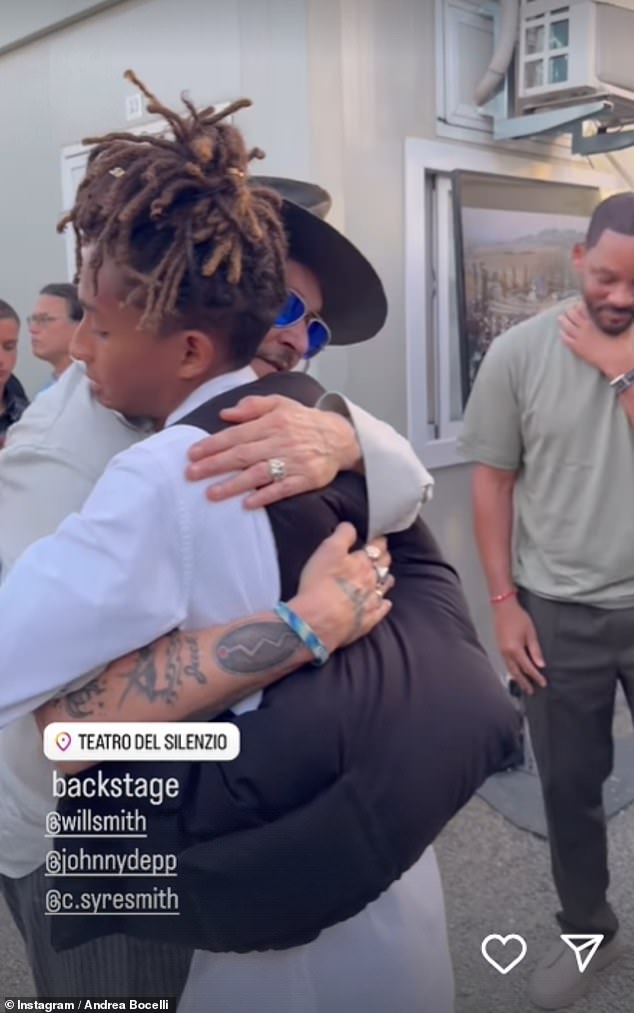 Depp then gave Will's son Jaden a warm hug.