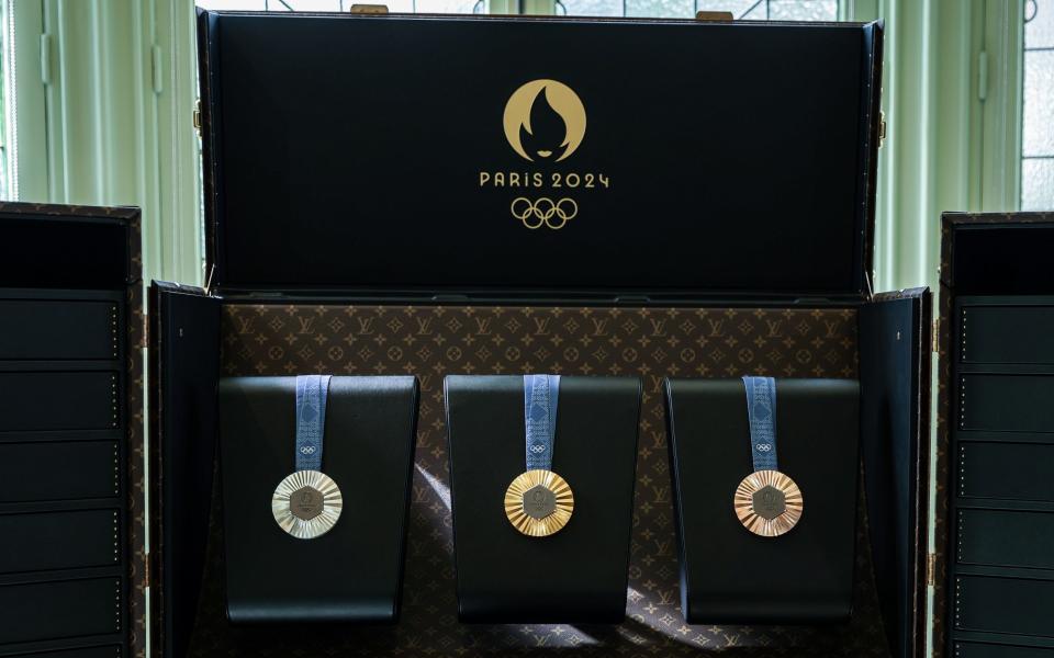 An open trunk displays the medals of the 2024 Paris Olympics