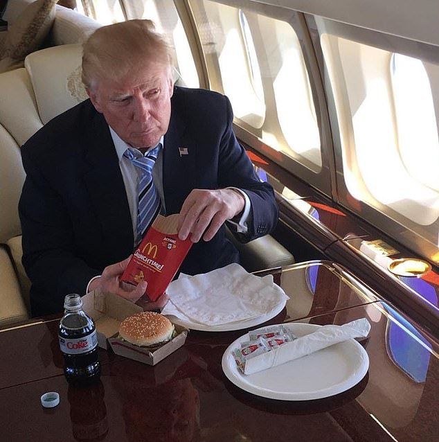 Donald Trump is pictured above enjoying a McDonald's and a Diet Coke on his private jet in 2016, which he did in celebration after winning the Republican Party nomination.