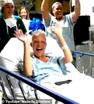 Another clip showed her being wheeled into surgery as a host of medical professionals lined the hallways and cheered her on.