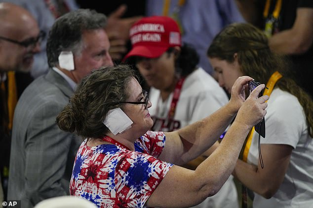 Many are said to have put the bandages on their heads after some people distributed them at the conference.