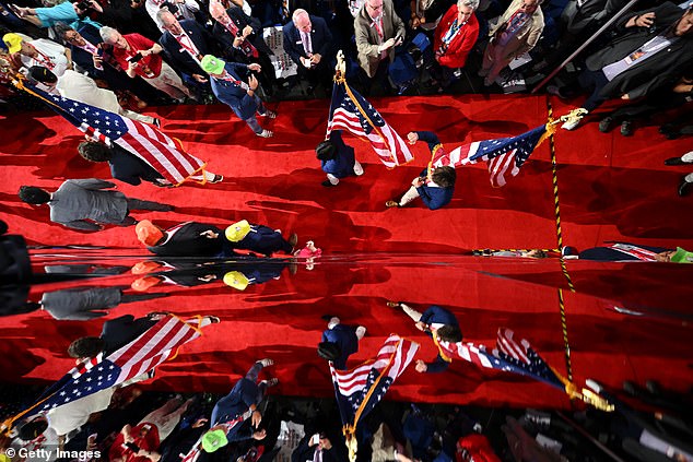 UNC fraternity boys carry the American flag on the third day of the Republican National Convention at Fiserv Forum on July 17, 2024