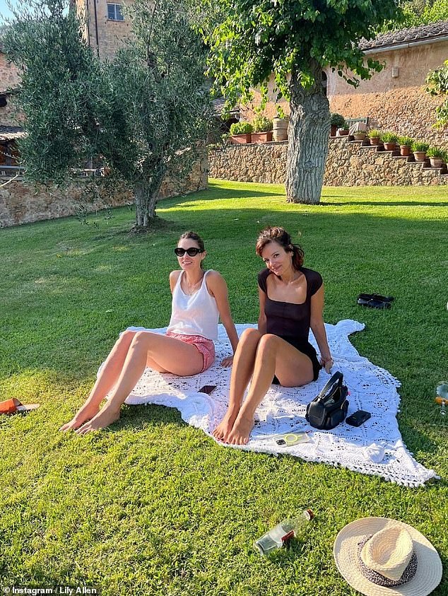 She also showed off her feet in a third photo, where the singer enjoyed a picnic in the villa's stunning grounds.