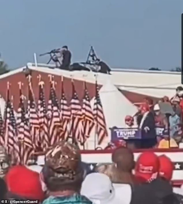 A Secret Service sniper unit is seen on the roof behind Trump. This team is believed to have returned fire on Crooks after he shot Trump. The roof they were deployed on also has a slope shown in this image.