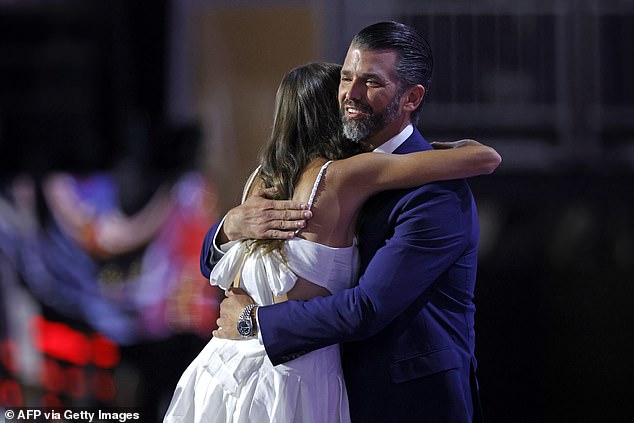 Donald Trump Jr. hugs his daughter after she introduced him on stage and recounted the attempted assassination of her grandfather