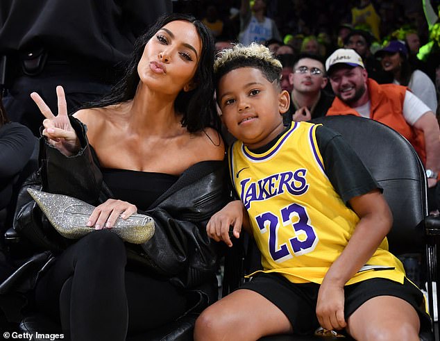 Kim and her eldest son, Saint, at a basketball game in December.