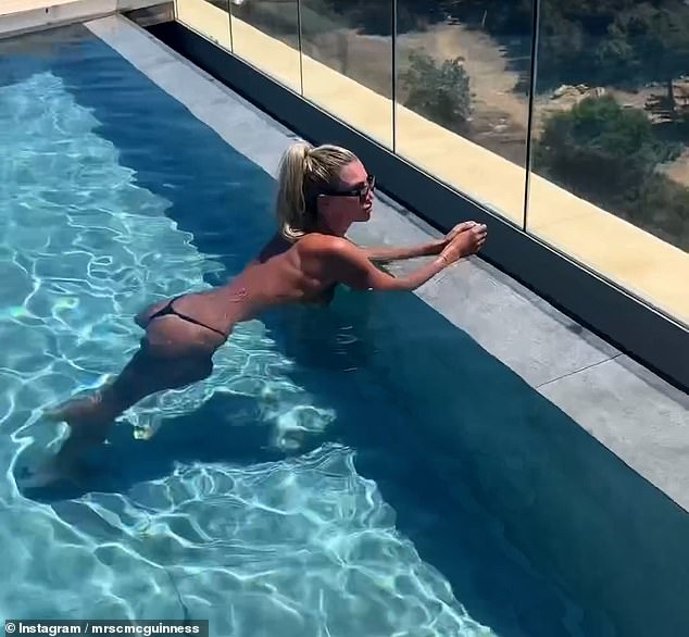 Sharing the video montage on her Instagram, Christine looked incredible as she swam topless in a pool.