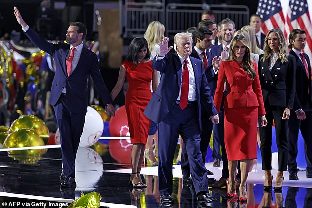 Former US President and 2024 Republican presidential candidate Donald Trump (center), along with former US First Lady Melania Trump (right), US Senator from Ohio and 2024 Republican vice presidential candidate JD Vance (left) and his wife Usha Vance (second left), leave the stage after accepting their party's nomination on the final day of the 2024 Republican National Convention.