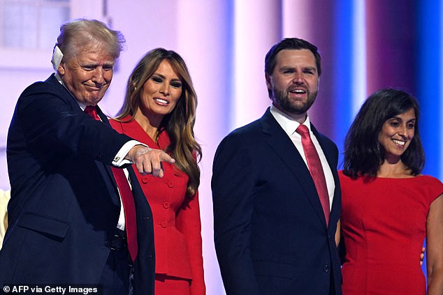 The former first couple and their running mates pose together on stage after the speech.