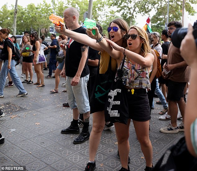 Protesters in Barcelona, ​​Spain, fired water pistols at foreign tourists along Las Ramblas and the city centre, which the Spanish government has condemned (pictured)