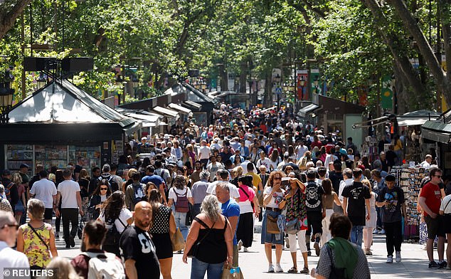 Barcelona residents protested on July 6 because tourists have driven up housing prices and they can no longer afford to live in the city (pictured, the tourist spot Las Ramblas)