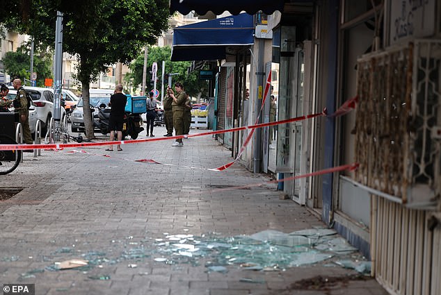 Shards of shattered glass can be seen on the streets of Tel Aviv following the drone strike after the 