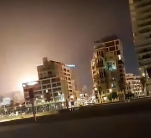 An orange glow is seen at the site of the explosion that left one dead and 10 injured