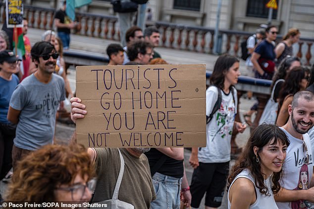 An anti-tourism banner during an anti-tourism demonstration in Barcelona earlier this month. More than 3,000 people have demonstrated against the overcrowding of tourists in the city of Barcelona and in favour of policies to reduce tourism.