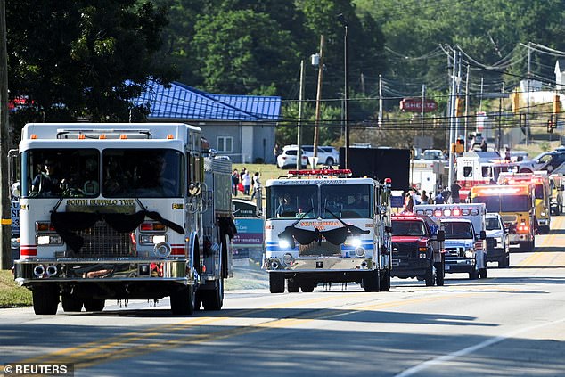 The huge procession of emergency vehicles, especially fire trucks, moved through Sarver, Pennsylvania.