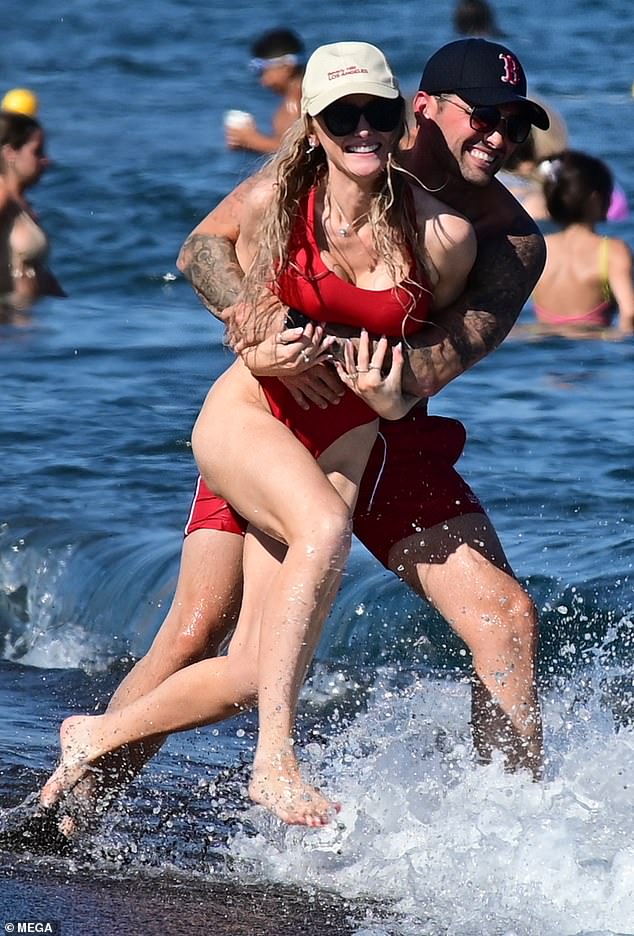 Ricky couldn't keep his hands off his beautiful girlfriend as they sported red swimsuits.