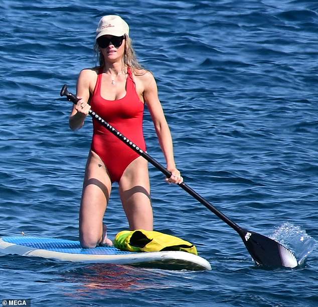 The soap opera star showed off her sensational figure in a low-cut one-piece swimsuit.